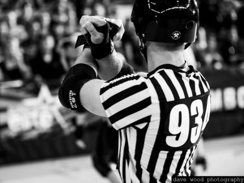 A photo of a Victorian Roller Derby League referee giving a penalty.