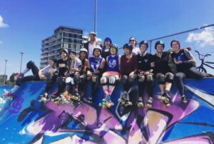 Victorian Roller Derby League Skaters hanging around at the skate park on a sunny day.