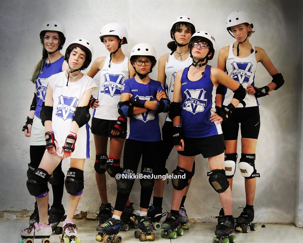 A group of our juniors dressed in uniform looking a mix of serious and defiant.